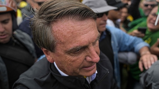 Brazil Elections 2022: Brazilian President and re-election candidate Jair Bolsonaro attends a motorcade on the eve of the presidential election.(AFP)