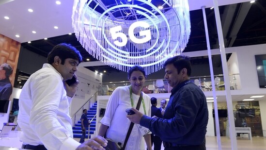 Visitors at India Mobile Congress 2022 exhibition in New Delhi.(Bloomberg)