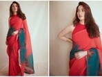 Tamannaah Bhatia wore a red crepe saree from the collection of designer Payal Khandwala for the latest photoshoot.(Instagram/@tamannaahspeaks)