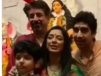 Ayan Mukerji with Rupali Ganguly and her family at a Durga Puja pandal. Ayan Mukerji with Rupali Ganguly and her family at a Durga Puja pandal.