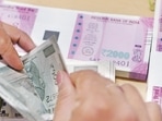 The rupee settled 33 paise higher at 81.40 against the dollar on Friday(AFP) The rupee settled 33 paise higher at 81.40 against the dollar on Friday(AFP)