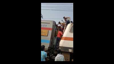 The mentally unwell youth being rescued from atop the engine of the Pawan Express in Prayagraj on Monday. (HT PHOTO) The mentally unwell youth being rescued from atop the engine of the Pawan Express in Prayagraj on Monday. (HT PHOTO)