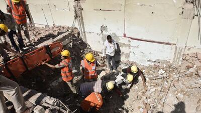 Gurugram, India - Oct. 03, 2022: NDRF and SDRF personnel during a rescue operation after an old building collapsed while it was being demolished, at Udyog Vihar Phase I, early morning in Gurugram, India, on Monday, October 03, 2022. (Photo by Vipin Kumar/ Hindustan Times) (Hindustan Times)