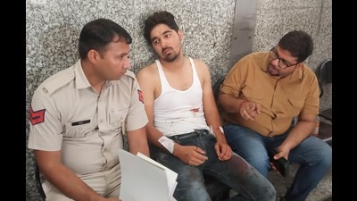Victim Laxmi Narayan giving his statement to the police; and (below) police questioning the last shopkeeper visited by him before he was attacked in Budhanpur village, Panchkula. (Sant Arora/HT)