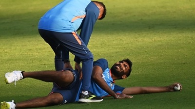 Jasprit Bumrah stretches during a practice session (AFP)