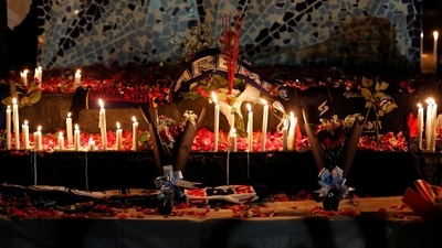Indonesia Stampede Accident: Candles, petals, and incenses placed by Arema FC supporters are seen during a vigil to pay condolence to the victims. (Reuters)