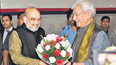 Jammu, Oct 03 (ANI): Union Home Minister Amit Shah being received by Jammu and Kashmir Lieutenant Governor Manoj Sinha upon his arrival, in Jammu on Monday. (ANI Photo) (Amit Shah Twitter) Jammu, Oct 03 (ANI): Union Home Minister Amit Shah being received by Jammu and Kashmir Lieutenant Governor Manoj Sinha upon his arrival, in Jammu on Monday. (ANI Photo) (Amit Shah Twitter)