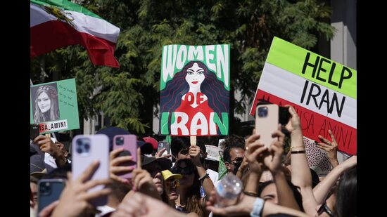 In Iran, thousands of women have poured onto the streets after a young woman was allegedly killed for not wearing the hijab in public (AP)