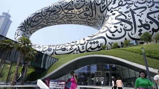 Visitors leave the Future Museum which is the venue for The Dubai Metaverse Assembly, in Dubai, United Arab Emirates, Wednesday, Sept. 28, 2022. (AP Photo/Kamran Jebreili)