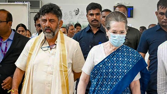 Congress interim President Sonia Gandhi with Karnataka Congress chief D.K. Shivakumar upon her arrival at Mysuru airport on Monday. (PTI)