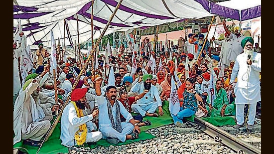 Farmers raise slogans as they block railway tracks during a protest on the first anniversary of the Lakhimpur Kheri case, at Lohian Khas Junction, in Jalandhar on Monday (ANI)