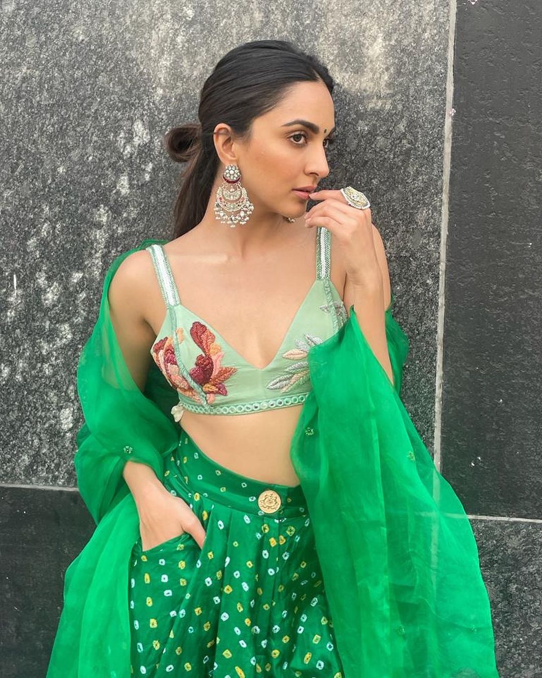 Kiara Advani dons a pair of green highwaisted bandhani flared pants with a bralette and organza dupatta (Photo: Instagram) Kiara Advani dons a pair of green highwaisted bandhani flared pants with a bralette and organza dupatta (Photo: Instagram)