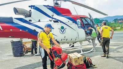 **EDS: IMAGE MADE AVAILABLE FROM SOCIAL MEDIA** Dehradun: SDRF teams leave from Sahastradhara helipad to rescue the trainees trapped in an avalanche in Draupadi's Danda-2 mountain peak, in Dehradun district. (PTI Photo)(PTI10_04_2022_000104B) (PTI)