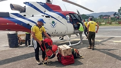 SDRF teams leave from Sahastradhara helipad in Dehradun to rescue mountaineering trainees trapped in an avalanche in Draupadi's Danda-2 mountain peak on Tuesday. (ANI Photo) SDRF teams leave from Sahastradhara helipad in Dehradun to rescue mountaineering trainees trapped in an avalanche in Draupadi's Danda-2 mountain peak on Tuesday. (ANI Photo)