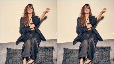 Rhea looked every bit gorgeous in a monochrome bralette with halter neck details. She layered it with a black oversized blazer and a pair of black formal trousers. (Instagram/@rhea_chakraborty)