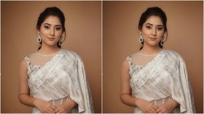 Disha looked every bit gorgeous in the silver saree gown featuring gathered up details at the waist and a detailed pallu with frills. She teamed her saree gown with an embellished white blouse with decorations in golden and silver resham threads. (Instagram/@dishaparmar) Disha looked every bit gorgeous in the silver saree gown featuring gathered up details at the waist and a detailed pallu with frills. She teamed her saree gown with an embellished white blouse with decorations in golden and silver resham threads. (Instagram/@dishaparmar)
