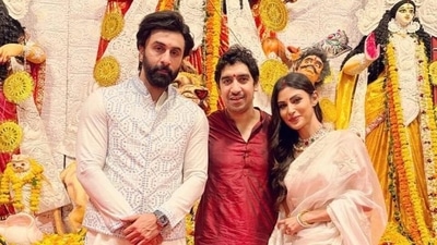 Mouni Roy poses with Ranbir Kapoor and Ayan Mukerji during Durga Pujo celebrations. (Instagram) Mouni Roy poses with Ranbir Kapoor and Ayan Mukerji during Durga Pujo celebrations. (Instagram)