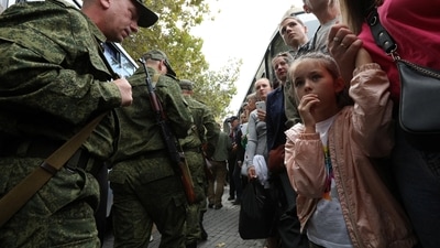 Russia-Ukraine War: People say goodbye to reservists drafted during the partial mobilisation as they depart for military bases, in Sevastopol, Crimea. (Reuters)