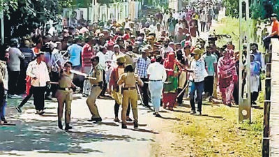 Porbandar, Oct 04 (ANI): Police personnel stop a crowd of locals over a demolition drive in Porbandar's Memonwada area on Tuesday. (ANI Photo) (ANI pic service) Porbandar, Oct 04 (ANI): Police personnel stop a crowd of locals over a demolition drive in Porbandar's Memonwada area on Tuesday. (ANI Photo) (ANI pic service)