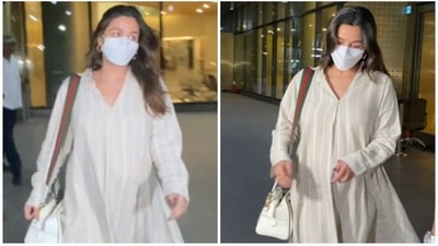 Mom-to-be Alia Bhatt clicked at the airport in a loose striped dress. (HT Photo/Varinder Chawla) Mom-to-be Alia Bhatt clicked at the airport in a loose striped dress. (HT Photo/Varinder Chawla)