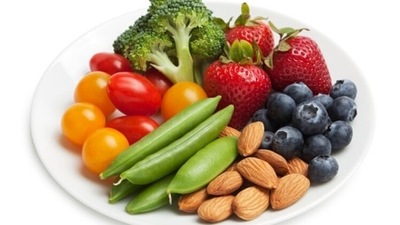 It is healthy to keep fruits and nuts in the work space for worktime munching cravings. (Unsplash)