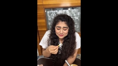 The image, taken from the video, shows the woman trying French fries dipped in Vanilla ice cream. (Instagram/@nerdysisters) The image, taken from the video, shows the woman trying French fries dipped in Vanilla ice cream. (Instagram/@nerdysisters)