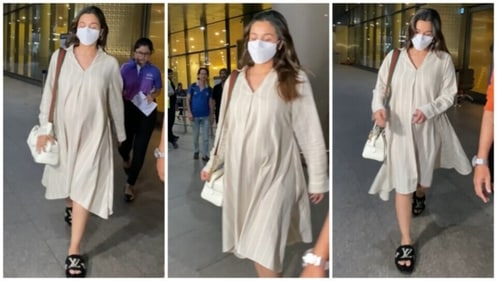 Alia Bhatt dons a loose striped dress for airport look. (HT Photo/Varinder Chawla) Alia Bhatt dons a loose striped dress for airport look. (HT Photo/Varinder Chawla)