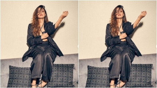 Rhea looked every bit gorgeous in a monochrome bralette with halter neck details. She layered it with a black oversized blazer and a pair of black formal trousers.(Instagram/@rhea_chakraborty)