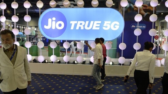 Visitors at the Reliance Jio Infocomm Ltd. booth at India Mobile Congress 2022 exhibition in New Delhi.(Bloomberg)