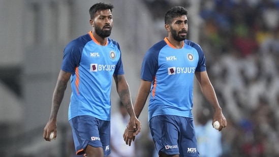 India's Jasprit Bumrah, right, and Hardik Pandya walk to warm up (AP)