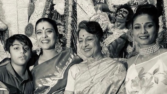 Kajol poses with son Yug, mother Tanuja and sister Tanisha Mukerji during Durga Puja celebrations.&nbsp;