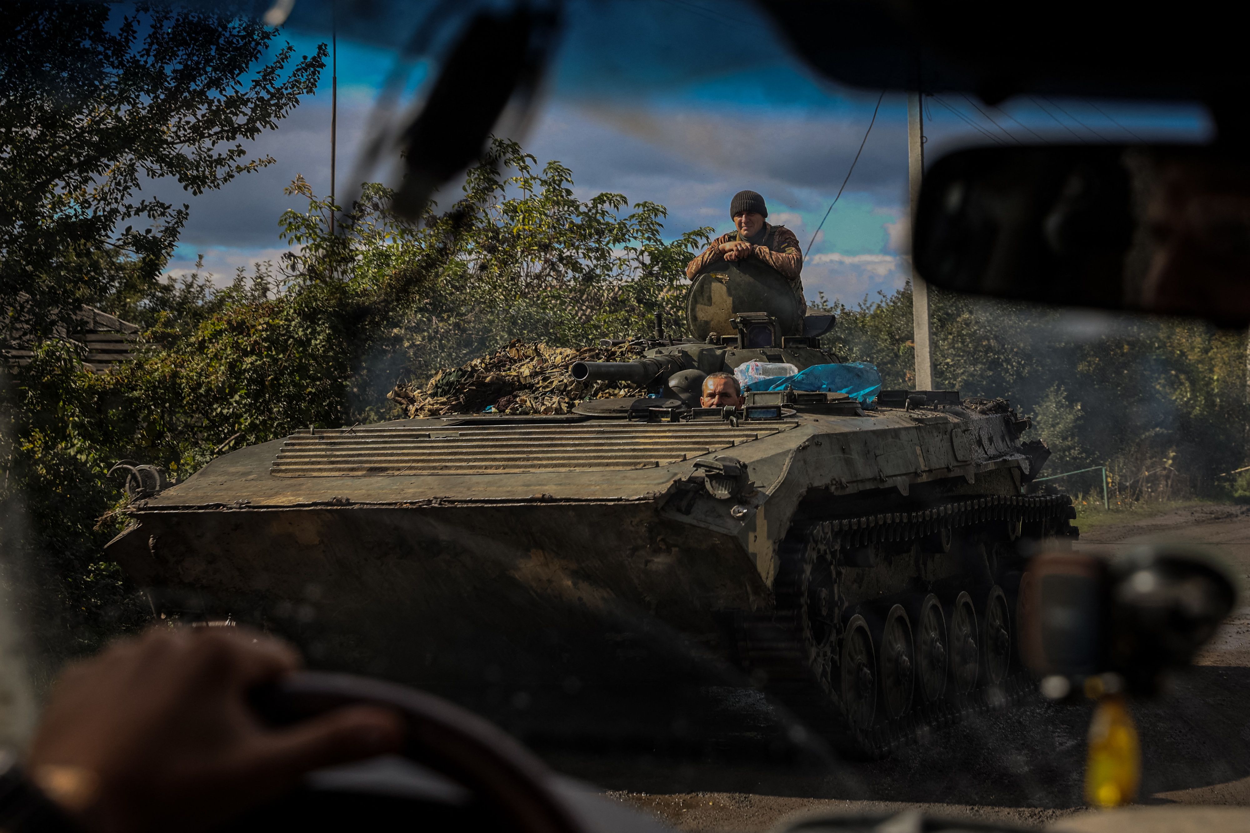 A Ukrainian APC rolls down a road at a position along the front line in Donetsk region amid the Russian invasion of Ukraine. (AFP) A Ukrainian APC rolls down a road at a position along the front line in Donetsk region amid the Russian invasion of Ukraine. (AFP)