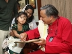 Sharing pictures on his Twitter profile, Tharoor said he taught nine kids who had visited him, to write “Om Shri“ in three scripts - Devanagari, Malayalam & English.(Twitter/Shashi Tharoor) Sharing pictures on his Twitter profile, Tharoor said he taught nine kids who had visited him, to write “Om Shri“ in three scripts - Devanagari, Malayalam & English.(Twitter/Shashi Tharoor)