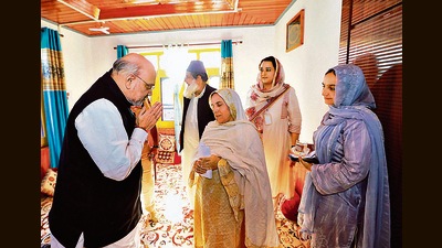 Union home minister Amit Shah meets the family of slain cop Mudassir Sheikh, in Baramulla. (ANI) Union home minister Amit Shah meets the family of slain cop Mudassir Sheikh, in Baramulla. (ANI)