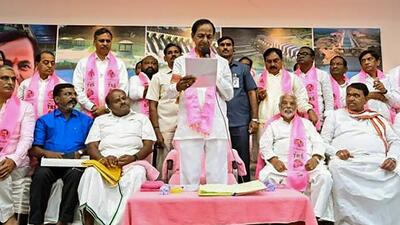 **EDS: TWITTER IMAGE POSTED BY @trspartyonline ON WEDNESDAY, OCT. 5, 2022** Hyderabad: TRS President and Telangana CM K Chandrashekar Rao reads out the unanimous decision of party's General Body to change the name of the party from Telangana Rashtra Samithi (TRS) to Bharat Rashtra Samithi (BRS). (PTI Photo)(PTI10_05_2022_000300B) (PTI) **EDS: TWITTER IMAGE POSTED BY @trspartyonline ON WEDNESDAY, OCT. 5, 2022** Hyderabad: TRS President and Telangana CM K Chandrashekar Rao reads out the unanimous decision of party's General Body to change the name of the party from Telangana Rashtra Samithi (TRS) to Bharat Rashtra Samithi (BRS). (PTI Photo)(PTI10_05_2022_000300B) (PTI)