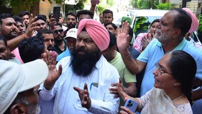 Councillor Mamta Ashu clarifying her stance on regularisation amid sloganeering by contractual MC employees outside her Model Gram residence. (Harvinder Singh/HT) Councillor Mamta Ashu clarifying her stance on regularisation amid sloganeering by contractual MC employees outside her Model Gram residence. (Harvinder Singh/HT)