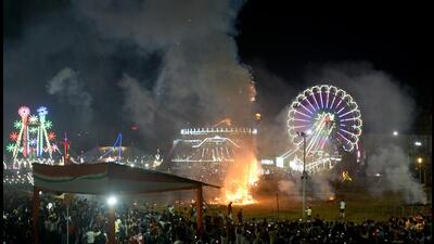 An effigy of demon king Ravana burns during the Dussehra celebrations at Noida Stadium in Sector 21A, on Wednesday. (Sunil Ghosh/Hindustan Times) An effigy of demon king Ravana burns during the Dussehra celebrations at Noida Stadium in Sector 21A, on Wednesday. (Sunil Ghosh/Hindustan Times)
