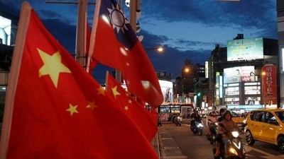 China-Taiwan Conflict: Flags of China and Taiwan flutter next to each other during a rally in Taipei, Taiwan. (Reuters) China-Taiwan Conflict: Flags of China and Taiwan flutter next to each other during a rally in Taipei, Taiwan. (Reuters)