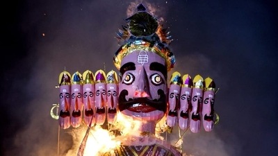 People watch the burning of an effigy of demon Ravana during the Dussehra at Shri Dharmik Leela Committee, Red Fort Ground, in New Delhi. (Photo by Sanjeev Verma) People watch the burning of an effigy of demon Ravana during the Dussehra at Shri Dharmik Leela Committee, Red Fort Ground, in New Delhi. (Photo by Sanjeev Verma)