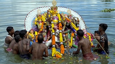 West Bengal: Devotees immerse an idol of Goddess Durga on the last day of the Durga Puja festival, in Nadia, Wednesday. (PTI) West Bengal: Devotees immerse an idol of Goddess Durga on the last day of the Durga Puja festival, in Nadia, Wednesday. (PTI)
