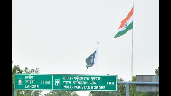The present 360-feet high flag was installed in March 2017 at a cost of <span class='webrupee'>₹</span>3.5-crore. In a tit-for-tat move, Pakistan hoisted a taller flag (400 feet) adjacent to the Wagah check post on the opposite side in August that year. The new Tricolour will be 18 ft long as compared to the Pakistani flag. (HT File Photo) The present 360-feet high flag was installed in March 2017 at a cost of <span class='webrupee'>₹</span>3.5-crore. In a tit-for-tat move, Pakistan hoisted a taller flag (400 feet) adjacent to the Wagah check post on the opposite side in August that year. The new Tricolour will be 18 ft long as compared to the Pakistani flag. (HT File Photo)