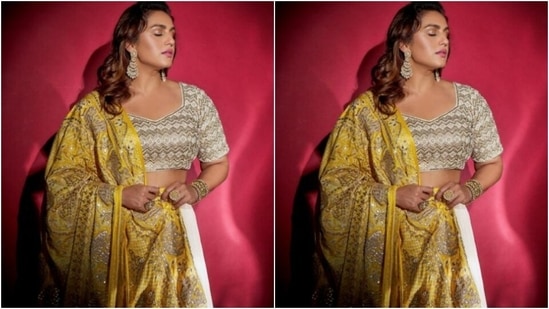 Huma wore a white blouse with heavy embroidery work in silver resham threads and paired it with a white flowy skirt. She added more festive vibes with a bright yellow dupatta heavily embroidered in silver resham threads.(Instagram/@iamhumaq)