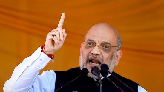 Union Home Minister Amit Shah addresses a public rally, at the Showkat Ali Stadium in Baramulla district of north Kashmir, Wednesday. (PTI) Union Home Minister Amit Shah addresses a public rally, at the Showkat Ali Stadium in Baramulla district of north Kashmir, Wednesday. (PTI)