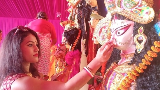 Debi boron is a practice on Vijaya Dashami when Durga Maa is welcomed for next year by putting sweets on the lips of the idol. Then the idols are taken for immersion.(Sant Arora, Hindustan Times)