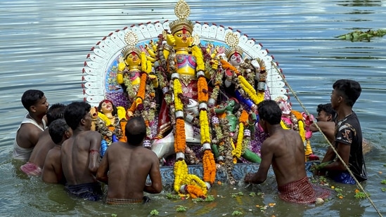 West Bengal: Devotees immerse an idol of Goddess Durga on the last day of the Durga Puja festival, in Nadia, Wednesday.(PTI)