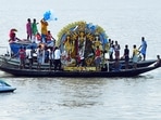 People take idols of Goddess Durga for immersion into the river Ganga on the final day of the Durga Puja festival, in Kolkata on Wednesday. (ANI File Photo) People take idols of Goddess Durga for immersion into the river Ganga on the final day of the Durga Puja festival, in Kolkata on Wednesday. (ANI File Photo)