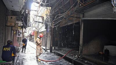 Firefighters inspect the incident site after a fire broke out at Gandhi Nagar's cloth market, in New Delhi on Thursday. (ANI) Firefighters inspect the incident site after a fire broke out at Gandhi Nagar's cloth market, in New Delhi on Thursday. (ANI)