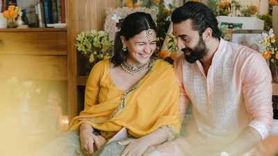 The first pictures features Alia Bhatt and Ranbir Kapoor in traditional fits. Alia Bhatt donned a bright yellow salwar suit while Ranbir complemented his wife in a pink embellished kurta set. (Instagram/@aliaabhatt) The first pictures features Alia Bhatt and Ranbir Kapoor in traditional fits. Alia Bhatt donned a bright yellow salwar suit while Ranbir complemented his wife in a pink embellished kurta set. (Instagram/@aliaabhatt)