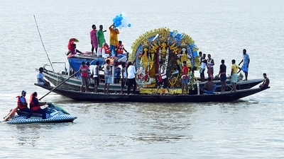 People take idols of Goddess Durga for immersion into the river Ganga on the final day of the Durga Puja festival, in Kolkata on Wednesday. (ANI File Photo) People take idols of Goddess Durga for immersion into the river Ganga on the final day of the Durga Puja festival, in Kolkata on Wednesday. (ANI File Photo)