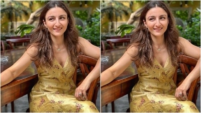 Soha looked pretty in a golden long dress as she stepped into a café in Mumbai with husband and family to celebrate her birthday. (Instagram/@sakpataudi)